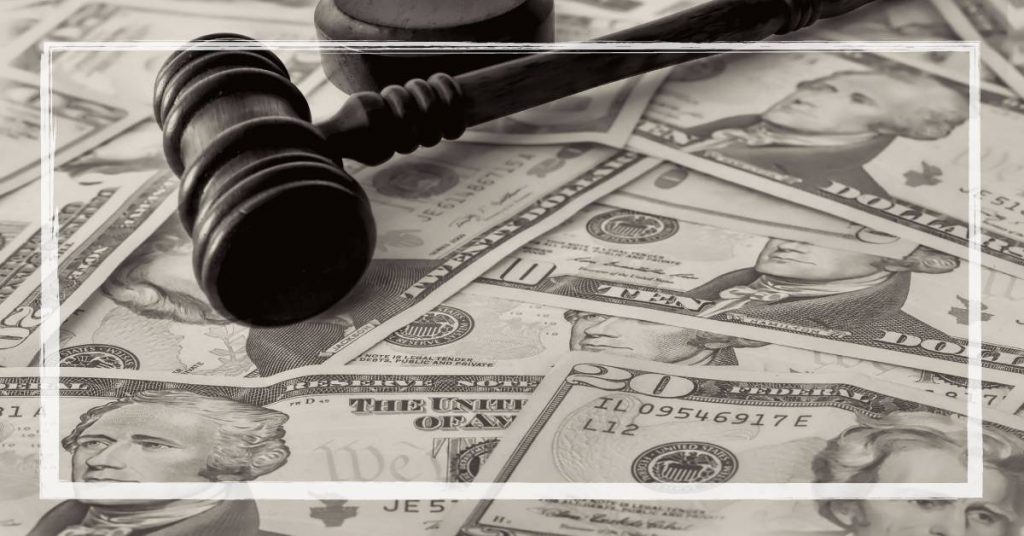 a gavel striking US currency bills symbolizing a legal settlement related to Medicaid fraud in orthodontic procedures