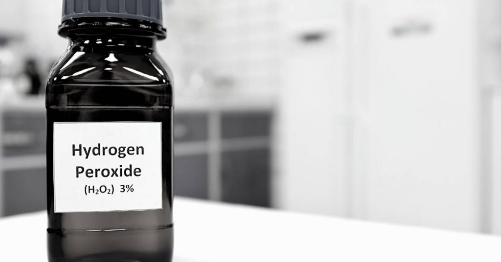 a dark bottle of three percent hydrogen peroxide antiseptic labeled for oral use