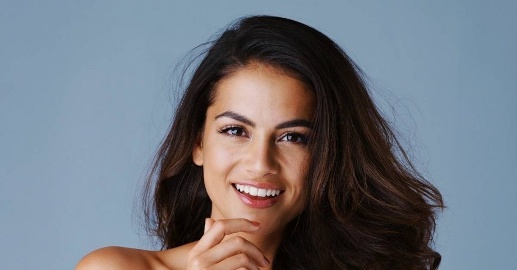 a smiling person with well-maintained teeth, showcasing bright, even results from dental care