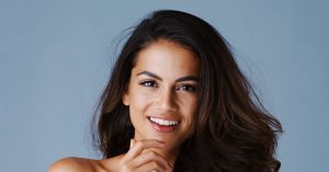 a smiling person with well-maintained teeth, showcasing bright, even results from dental care